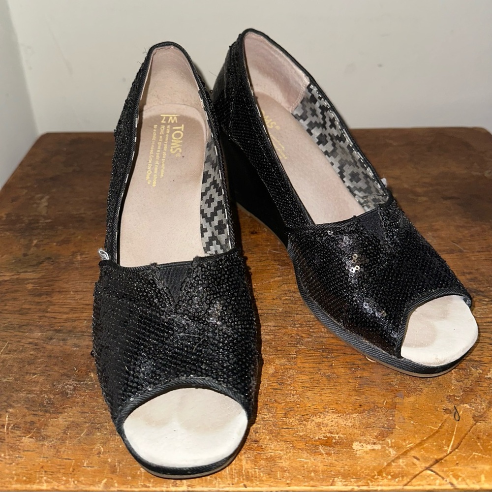 Sparkly black wedge heel by Toms in size 7